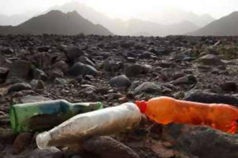 FUJAIRAH, UNITED ARAB EMIRATES- March 6: Visitors left behind their used cold drink bottles at the Wadi Wurayah in Fujairah Mountains.  (Pawan Singh / The Nation)

 *** Local Caption *** PS263- WADI WURAYAH.jpg