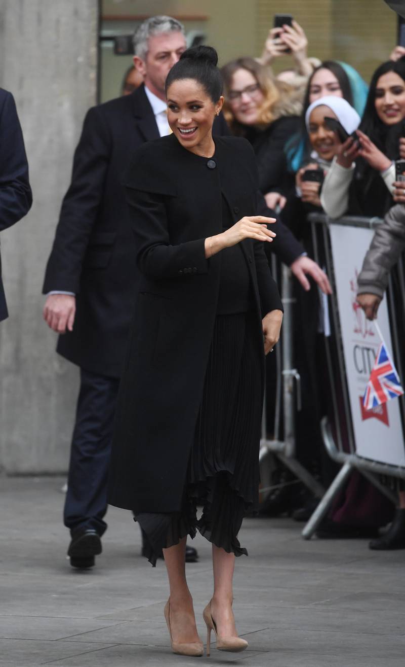 Meghan, Duchess of Sussex, wears Givenchy at the City University of London, on January 31, 2019. EPA