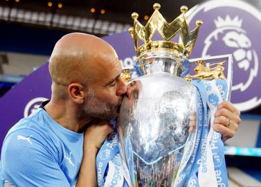 File photo dated 22-05-2022 of Manchester City manager Pep Guardiola with the Premier League trophy. Premier League champions Manchester City will begin the defence of their title at West Ham in the final match of the opening weekends fixtures. Issue date: Thursday June 16, 2022.