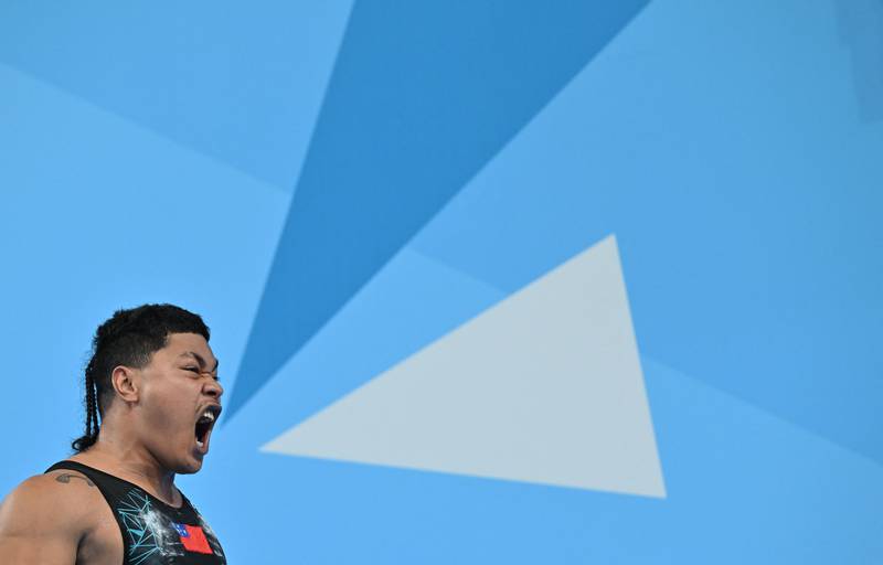Samoa's Jack Hitila Opeloge celebrates while competing in the men's 109-kilogram snatch weightlifting event on day six of the Commonwealth Games in Birmingham, England. AFP