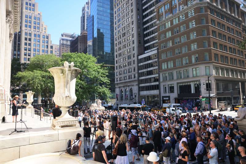 The rally was held between the iconic New York Public Library lions. Getty Images / AFP

