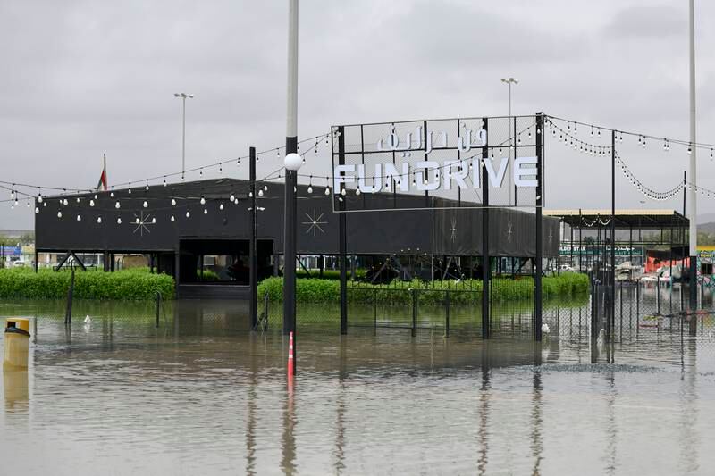 Floodwaters surround a leisure and entertainment area in Fujairah. Khushnum Bhandari / The National
