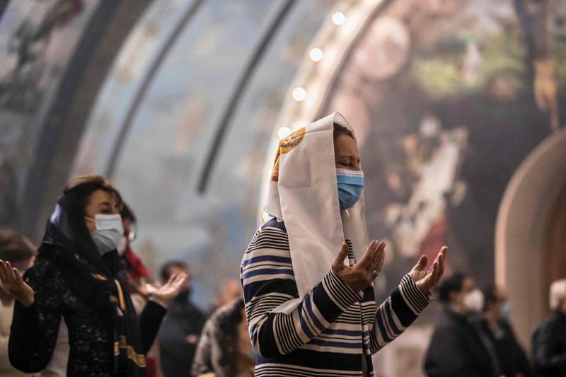 Worshippers at Christmas Mass at the Archangel Michael Coptic Orthodox Church. The Coptic Orthodox Church traces its origins to the first century when the Apostle Mark is said to have visited Egypt. AFP