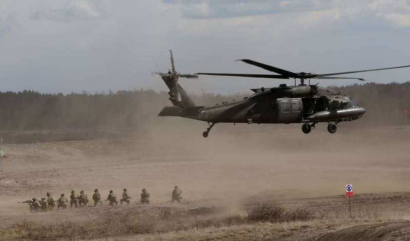 Members of Polish 18th Mechanised Division and members of the US 82nd Airbourne Division participate in a joint military training in Nowa Deba, Poland, in April. Reuters
