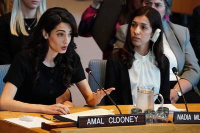 Nadia Murad listens as Amal Clooney speaks at the United Nations Security Council during a meeting about sexual violence in conflict in New York, New York, U.S., April 23, 2019.   REUTERS/Carlo Allegri