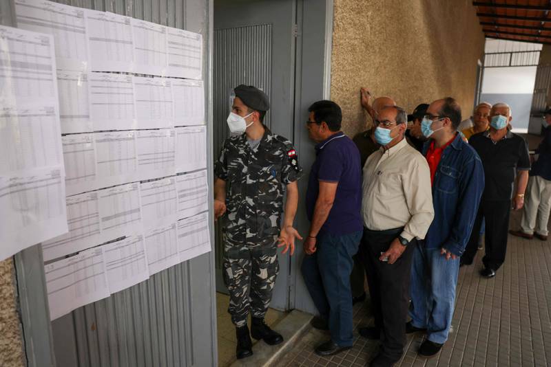 Voters queue outside a polling station near the city of Byblos.  AFP