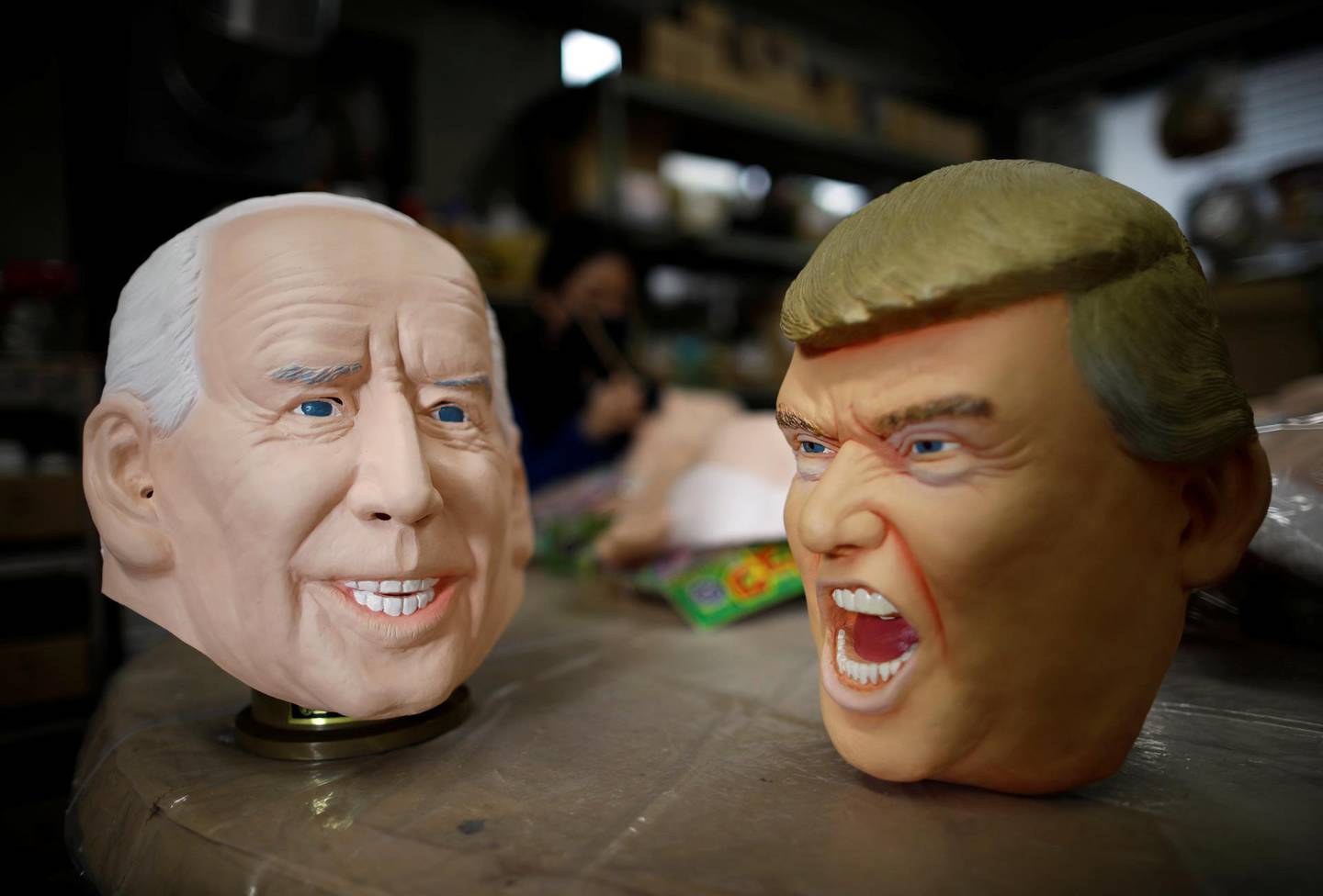 Masks depicting U.S. President-elect Joe Biden and President Donald Trump are displayed at Ogawa Studios, a mask and toy making company, in Saitama, Japan November 12, 2020. REUTERS/Issei Kato