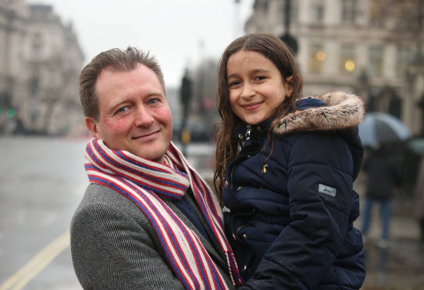 Richard Ratcliffe, with his daughter Gabriella, outside the Houses of Parliament in London on Wednesday, after his wife Nazanin Zaghari-Ratcliffe was freed from detention. PA