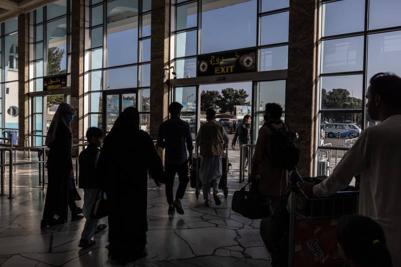 Passengers leave the domestic terminal at Kabul airport. Stefanie Glinski for The National