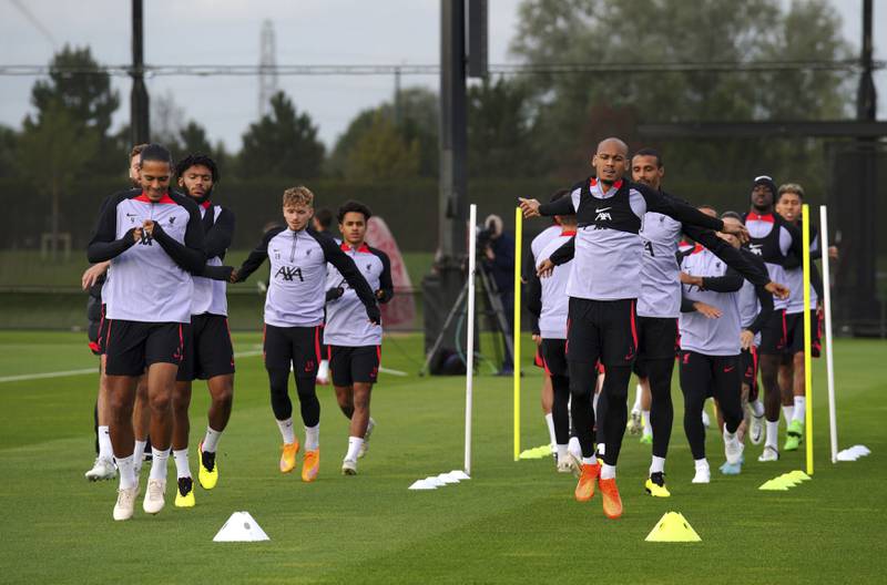 Liverpool's Virgil van Dijk, left, and Fabinho, right, training with teammates. AP