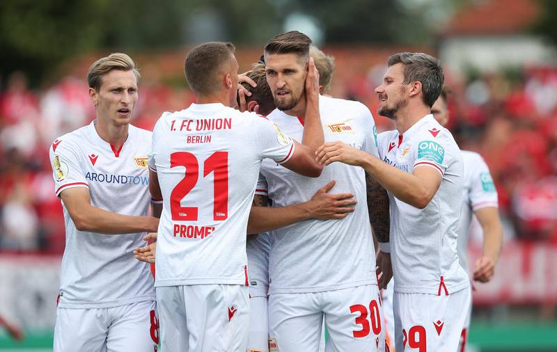 HALBERSTADT, GERMANY - AUGUST 11: (L-R) Joshua Mees, Grischa Proemel, Robert Andrich and Michael Parensen of Berlin celebrate during the DFB Cup first round match between VfB Germania Halberstadt and 1. FC Union Berlin at Friedensstadion on August 11, 2019 in Halberstadt, Germany. (Photo by Ronny Hartmann/Bongarts/Getty Images)
