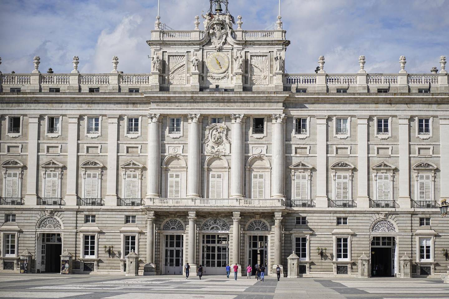 Tourists stand outside the royal palace in Madrid, Spain, on Tuesday, Sept. 22, 2020. The Madrid regional government said last week it will test 1 million people — about every seventh resident of the Spanish capital region — for Covid-19 over the next week to stem the surge in cases. Photographer: Paul Hanna/Bloomberg