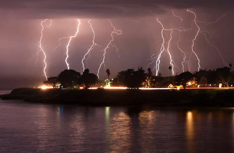 A rare lightning storm crackles over Mitchell's Cove in early morning in Santa Cruz, California in August. AP