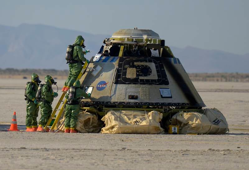 Nasa teams work outside Boeing’s CST-100 Starliner spacecraft after it landed at White Sands Missile Range’s Space Harbour, in Las Cruces, New Mexico. Boeing’s Orbital Flight Test-2 (OFT-2) is Starliner’s second uncrewed flight test to the International Space Station as part of Nasa’s Commercial Crew Programme. EPA 