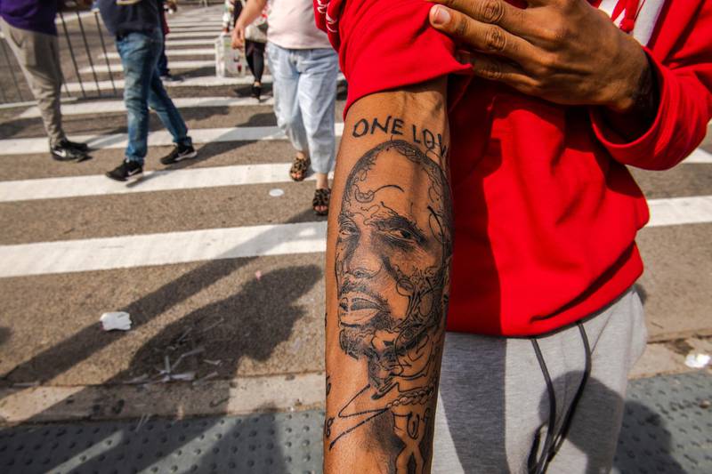 Aaron Baines, 22, shows off his recent tattoo of rapper DMX. AP Photo