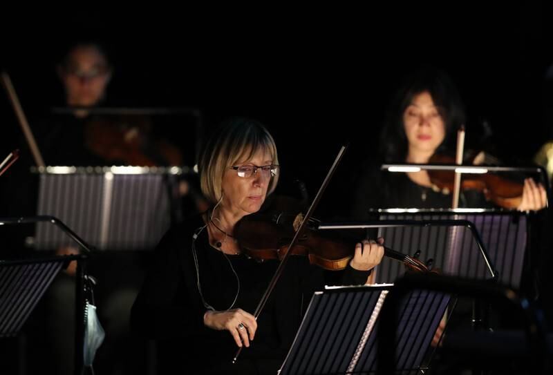 The string section of the Armenian State Symphony Orchestra during 'Joker: Live in Concert'  on Tuesday at the Dubai Opera.
