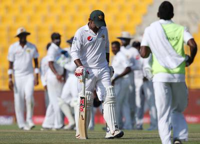 Sri Lanka celebrate the dismissal of Pakistan's Sarfraz Ahmed during their fifth day at First Test cricket match in Abu Dhabi, United Arab Emirates, Monday, Oct. 2, 2017. (AP Photo/Kamran Jebreili)