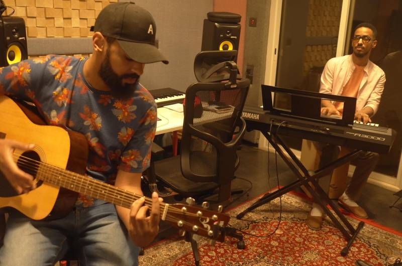 Musicians Anas Subeati and Bader Abogoda rehearse a reggae composition at the recording studio in Studio Gharem. James Langton. 