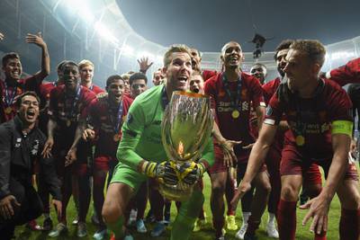 Adrian of Liverpool lifts the UEFA Super Cup trophy as Liverpool celebrate. Getty Images