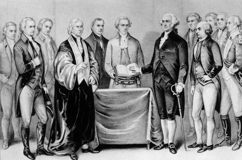 1788:  The inauguration of George Washington as the first President of the United States, also present are (from left) Alexander Hamilton, Robert R Livingston, Roger Sherman, Mr Otis, Vice President John Adams, Baron Von Steuben and General Henry Knox.  Original Artwork: Printed by Currier & Ives.  (Photo by MPI/Getty Images)
