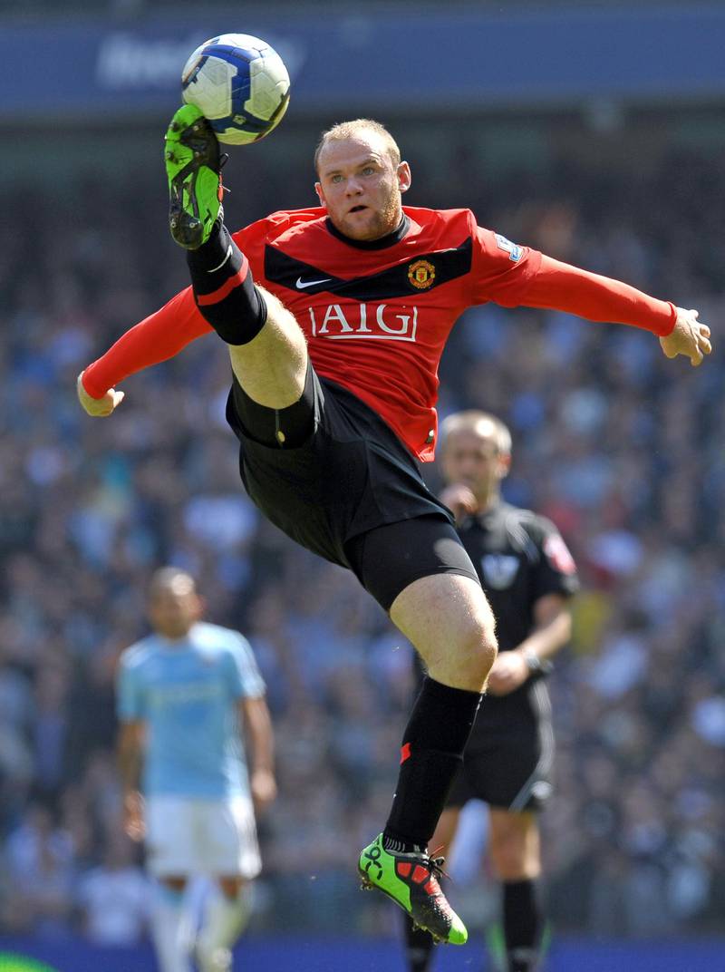 Manchester United striker Wayne Rooney jumps to control the ball during the Premier League match against Manchester City at the City Of Manchester Stadium on April 17, 2010. AFP