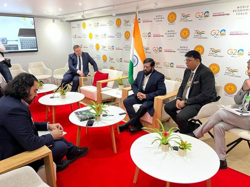 Eknath Shinde, Chief Minister of Maharashtra, centre, at the Indian state's pavilion in Davos, Switzerland, during the World Economic Forum Annual Meeting. 