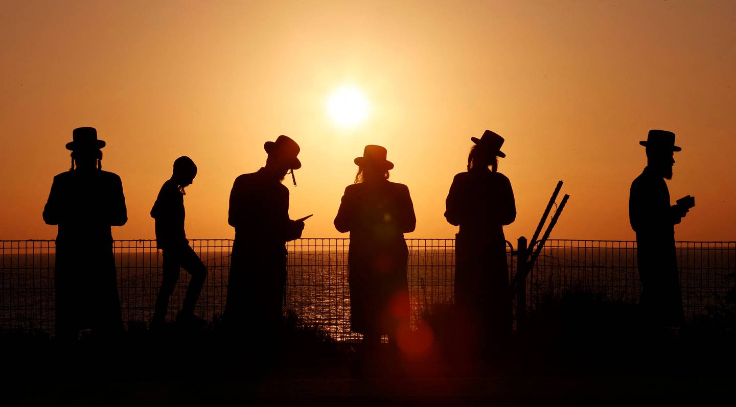 Ultra-Orthodox Jewish men and children in the coastal city of Netanya on September 14. AFP