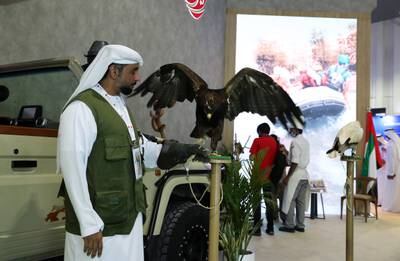 Staff from Al Ain Zoo showing some birds and reptiles at the Abu Dhabi stand.