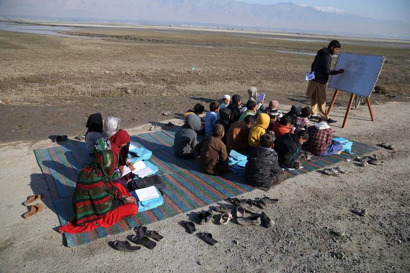 Afghan children take a class in open due to lack of school and facilities in Laghman.  EPA