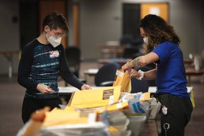 Election officials count absentee ballots in Milwaukee, Wisconsin. AFP