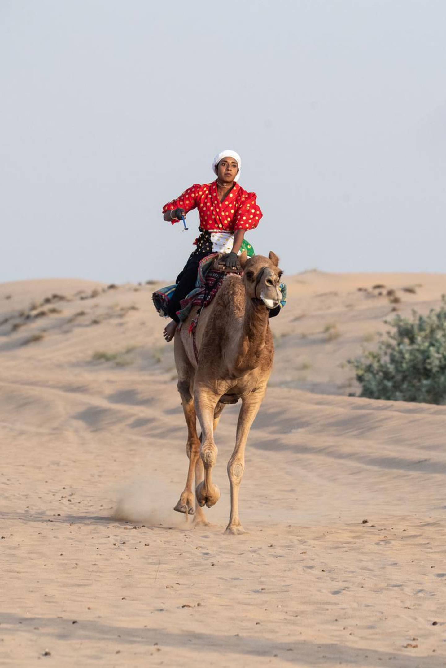 Ms Al Blooshi trains with camels at the Al Marmoom Race Track. Photo: Khawla Al Blooshi