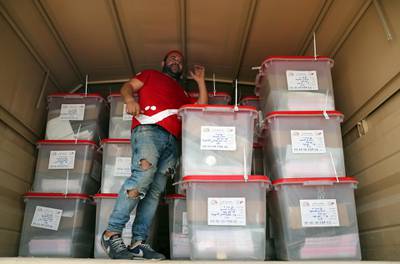Workers of Tunisia's Independent High Authority for Elections (ISIE) dispatch ballot boxes to polling stations ahead of tomorrow's presidential election in Tunis, Tunisia. The first round of the presidential election in Tunisia will be held on 15 September.  EPA