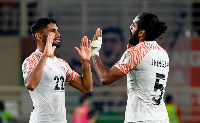 India's defenders Sandesh Jhingan, right, and Anas Edathodika celebrate. AFP