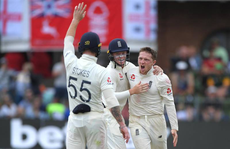 England's Dom Bess, right, celebrates after taking the wicket of Rassie van der Dussen - the spinner's fifth of the innings in the Third Test. Getty