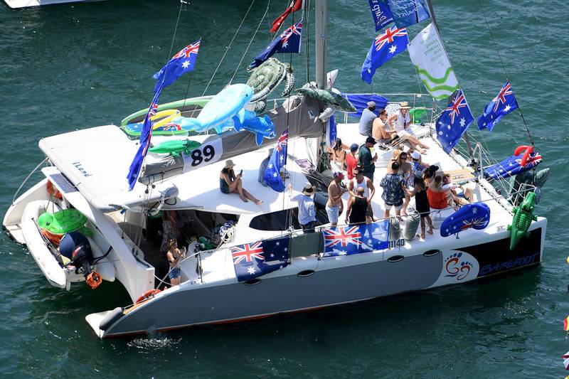 People stand on the deck of a spectator craft in Sydney Harbour during Australia Day celebration in Sydney, Australia.  EPA