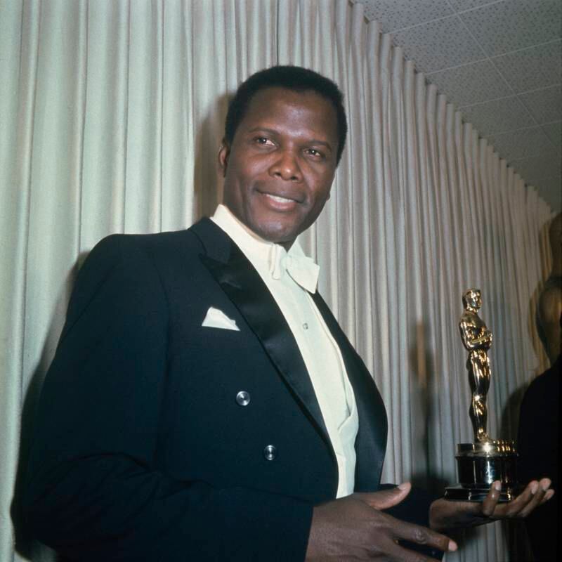 Sidney Poitier holding his Academy Award for Best Actor in a Leading Role for 'Lilies Of The Field', at the 36th Academy Awards ceremony in 1964. Getty Images