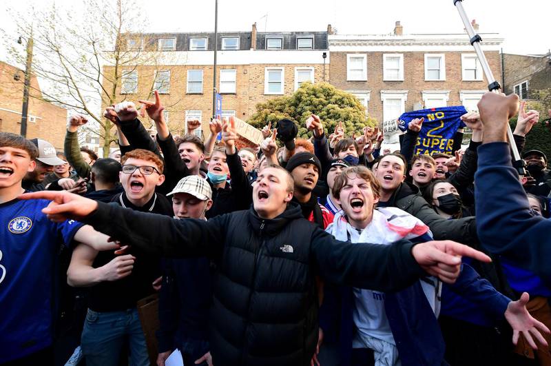 Fans react after potential news that Chelsea are preparing to withdraw from the Super League, outside Stamford Bridge, London. Picture date: Tuesday April 20, 2021. PA Photo. Six English clubs Arsenal, Chelsea, Liverpool, Manchester City, Manchester United and Tottenham announced on Sunday in a joint statement they are to join a new European Super League. See PA story SOCCER European. Photo credit should read: Ian West/PA Wire