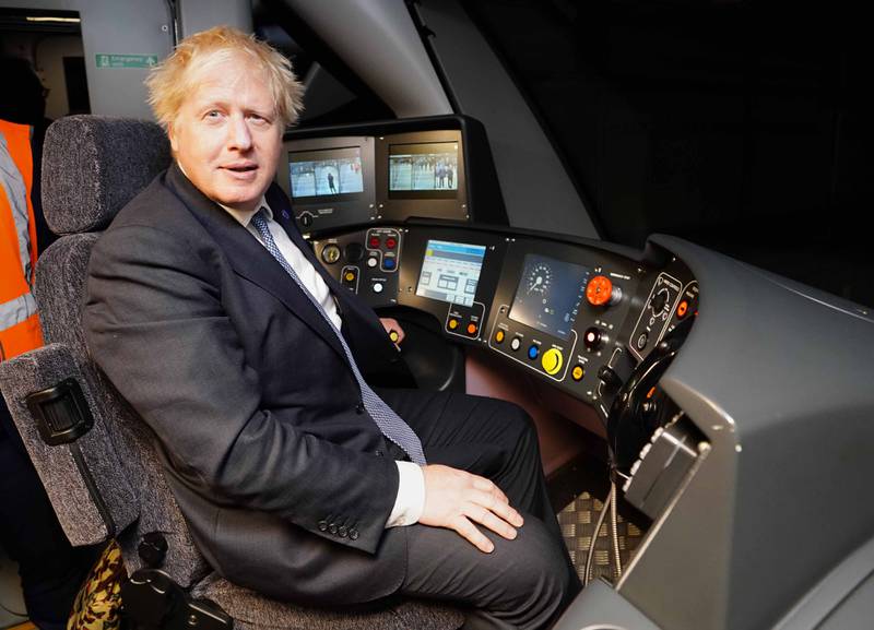 Boris Johnson in the driver's seat of a train. PA