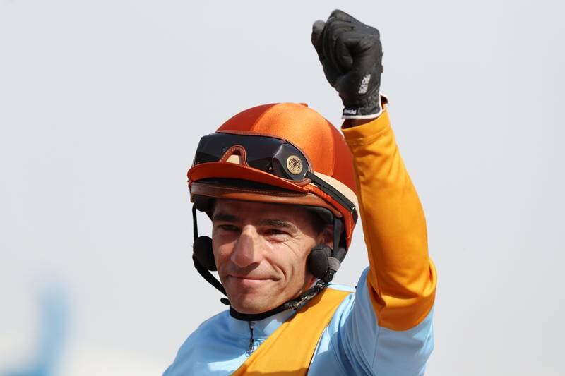 Jockey Ronan Thomas celebrates after winning the Dubai Kahayla Classic on First Classs. Chris Whiteoak / The National