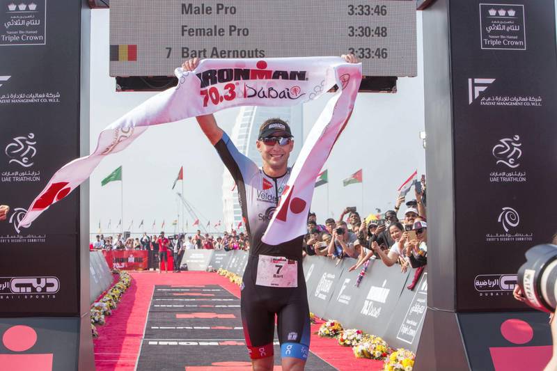Dubai, United Arab Emirates - Ironman pro winner  men1st place Bart Aernouts at the finish line at the Ironman race at Jumeirah open beach, Dubai. Leslie Pableo for The National