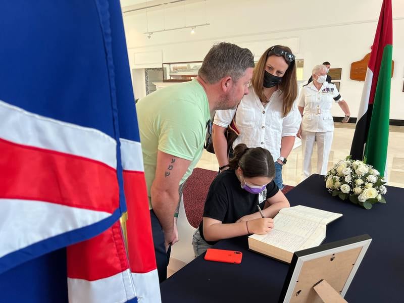 Mourners sign a book of condolence for the late Queen Elizabeth II at the 'QE2' in Dubai. All photos: Andrew Scott / The National