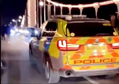 A police car arrives at the Chelsea Bridge car meet. London 999 feed