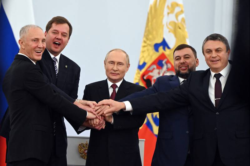 From left, Moscow-appointed head of Kherson region Vladimir Saldo, Moscow-appointed head of Zaporizhzhia region Yevgeny Balitsky, Russian President Vladimir Putin, leader of the Donetsk People's Republic Denis Pushilin,  and leader of the Luhansk People's Republic Leonid Pasechnik during a ceremony to sign an annexation agreement with Russia in Moscow. AP