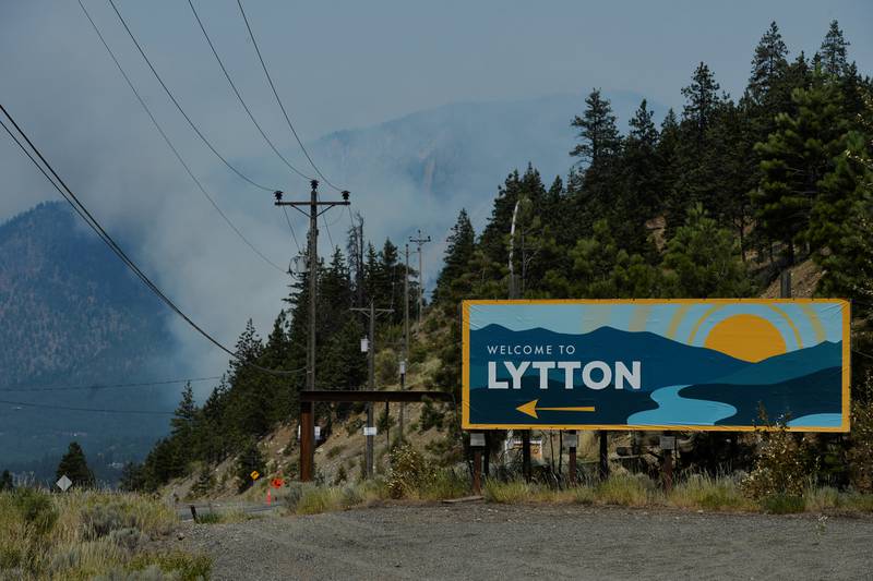 The sign for the town of Lytton, where a wildfire raged through and forced residents to evacuate, is seen in Lytton, British Columbia.