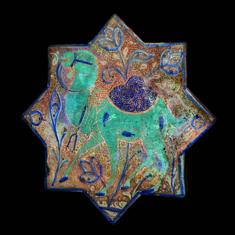 A Kashan Luster, turquoise and cobalt blue star tile depicting a camel with a saddle, from Iran. It was made in the later 13th and early 14th centuries.