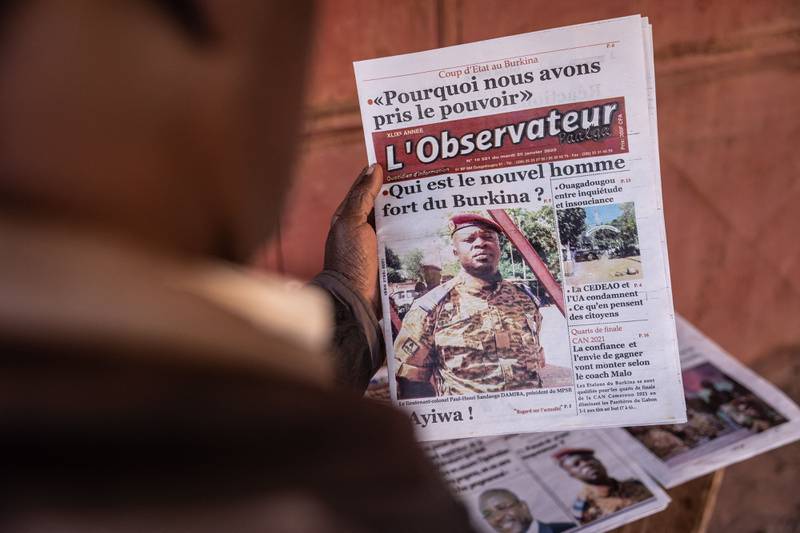 A picture of Paul-Henri Sandaogo Damiba, reported to be the leader of the mutiny, appears on a newspaper in Ouagadougou, Burkina Faso, on Tuesday. President Roch Marc Christian Kabore has been removed in a coup in the West African country. AFP