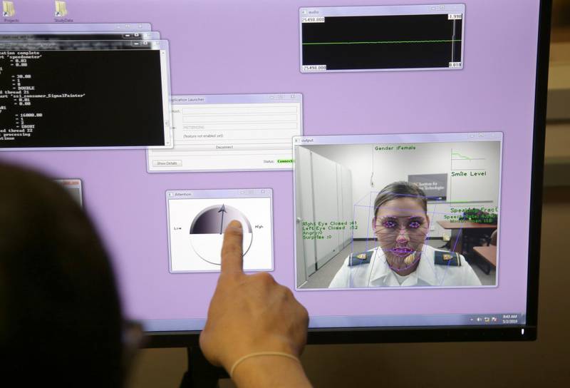 In this file photo from May 2, 2019, a computer monitors some of Cadet Cheyenne Quilter's reactions as she works with a virtual reality character named "Ellie" at the U.S. Military Academy at West Point, N.Y. Artificial intelligence is spreading into health care, often as software or a computer program capable of learning from large amounts of data and making predictions to guide care or help patients. (AP Photo/Seth Wenig, File)