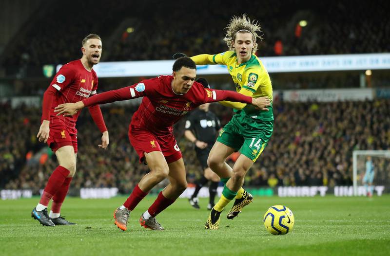 Soccer Football - Premier League - Norwich City v Liverpool - Carrow Road, Norwich, Britain - February 15, 2020  Norwich City's Todd Cantwell in action with Liverpool's Trent Alexander-Arnold and Jordan Henderson   REUTERS/Chris Radburn  EDITORIAL USE ONLY. No use with unauthorized audio, video, data, fixture lists, club/league logos or "live" services. Online in-match use limited to 75 images, no video emulation. No use in betting, games or single club/league/player publications.  Please contact your account representative for further details.