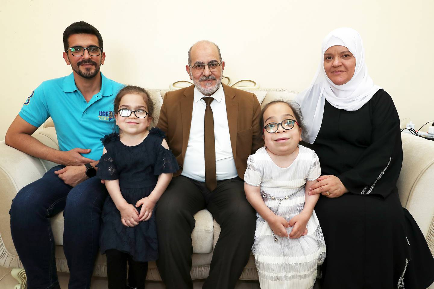 Samir Hamasha, centre, with his wife, daughters Saba and Bushra and son Loay at their home in Dubai. Pawan Singh / The National