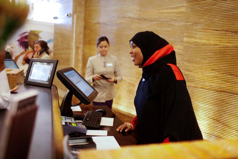 Dubai, April 11, 2013 - Fatma Al Shabibi, head of front of house guest relations at the Mall of the Emirates Kempinski Hotel, is photographed interacting with hotel guests in Dubai, April 11, 2013. (Photo by: Sarah Dea/The National)

